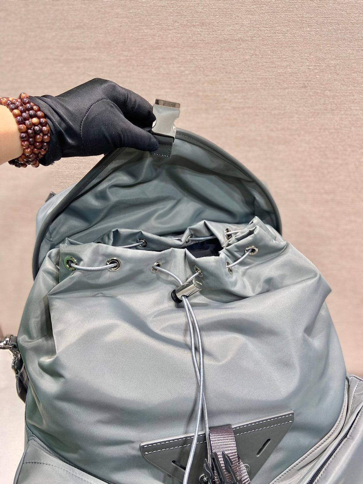 PRADA TRIANGLE LOGO BACKPACK 45 IN ASH GRAY RE-NYLON