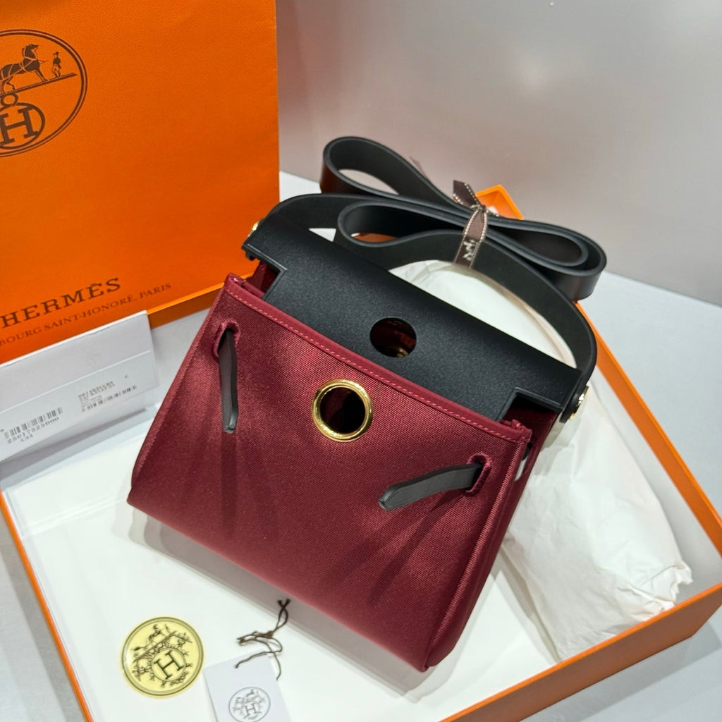 HERMES 25S MINI HERBAG 20 IN RED AND BLACK CANVAS GOLD HARDWARE