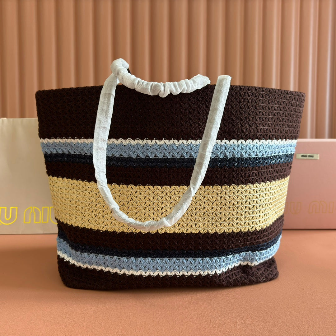 TOTE BAG 40 IN STRIPED PATTERN OF BROWN BLUE AND YELLOW WOVEN RAFFIA