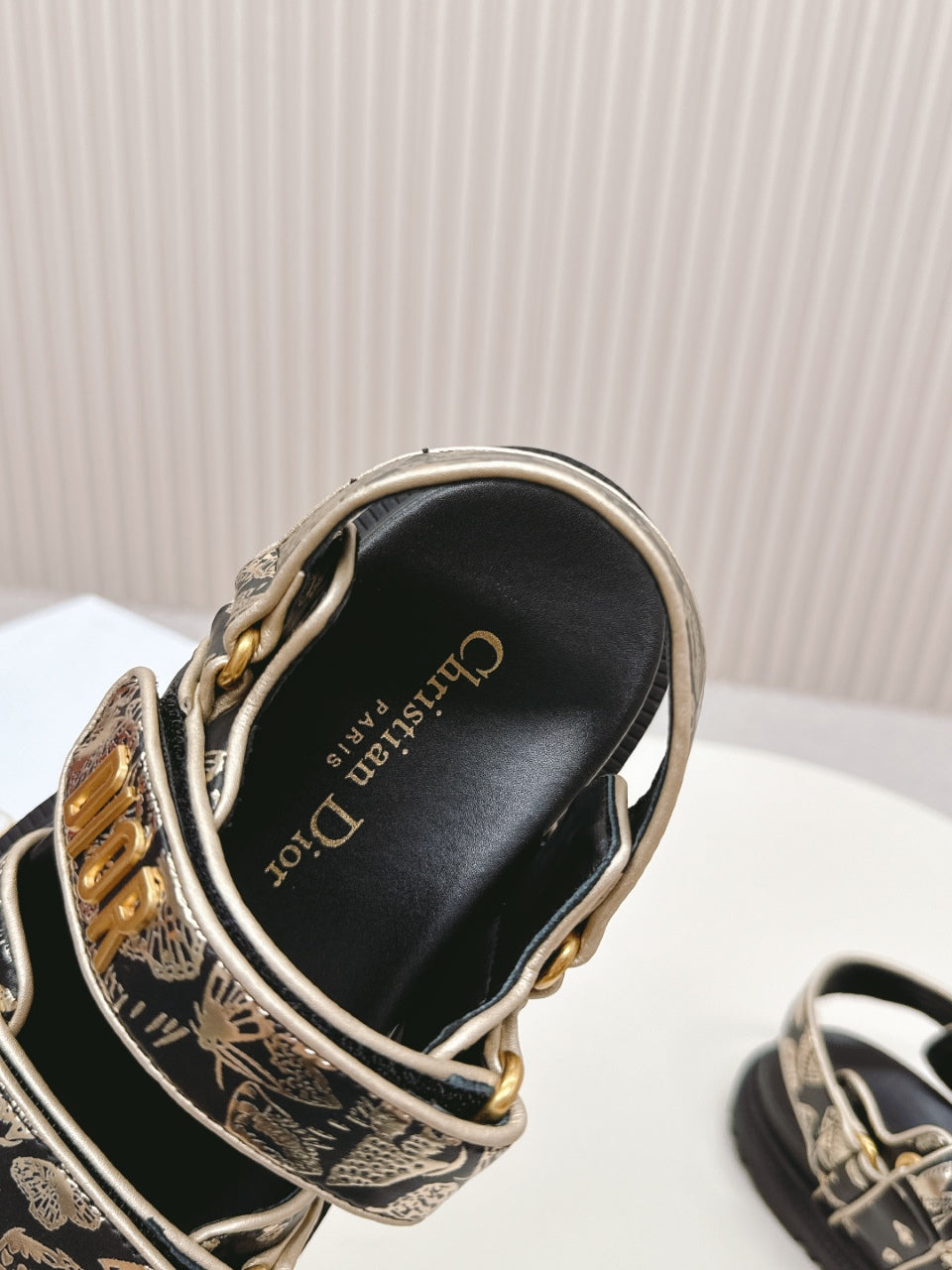 DIOR BACK-STRAP SANDALS 25S IN BLACK AND GOLD CALFSKIN WITH BUTTERFLY MOTIF